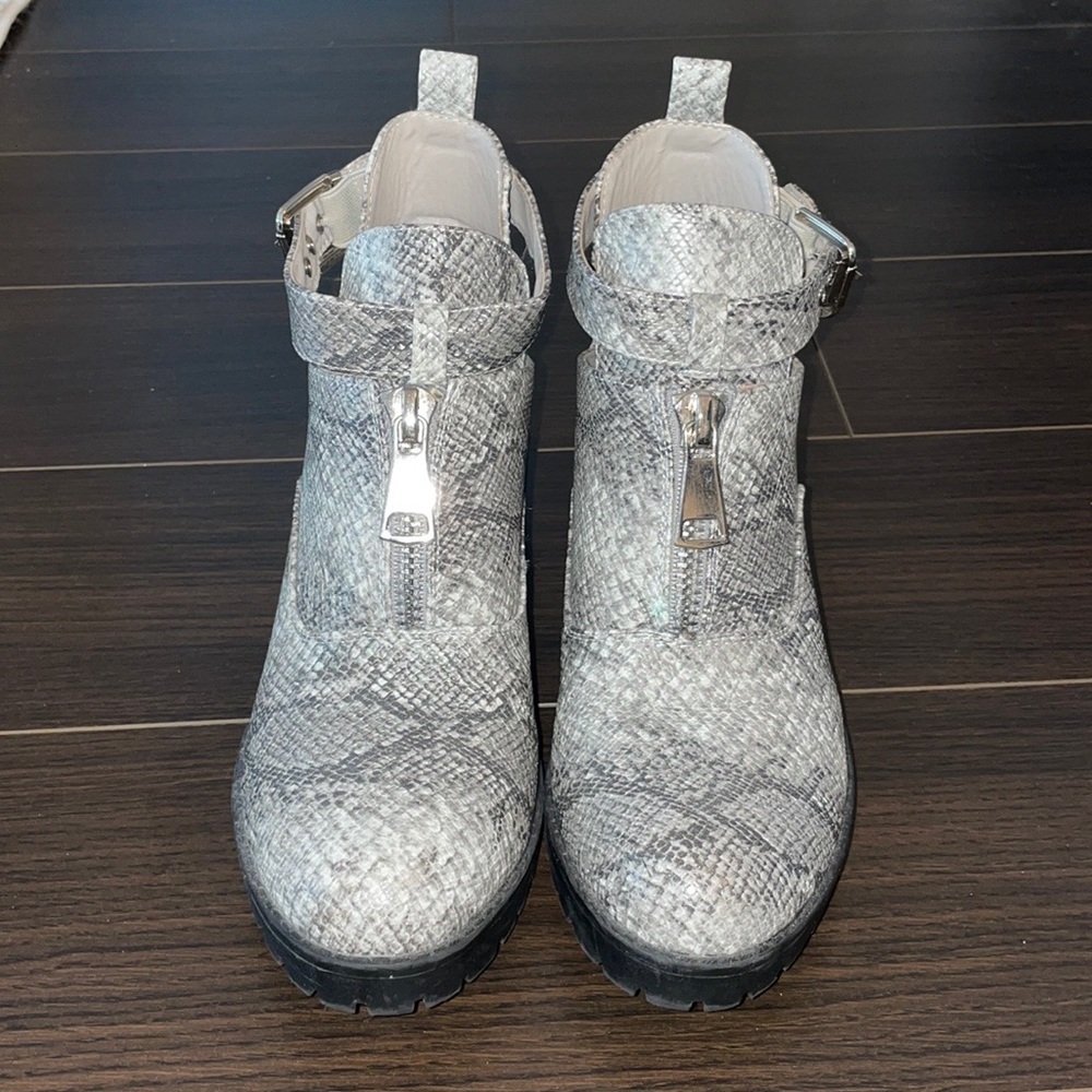Snake print low boots with zipper in front